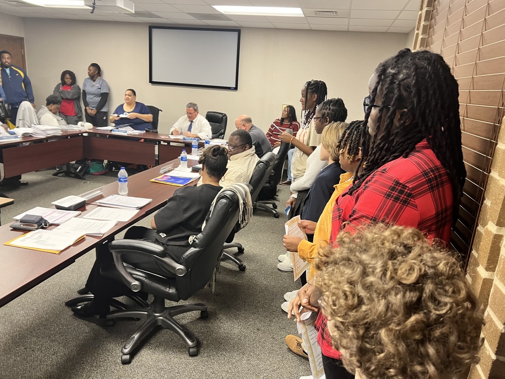 Students from all elementary schools present to school board for special month.
