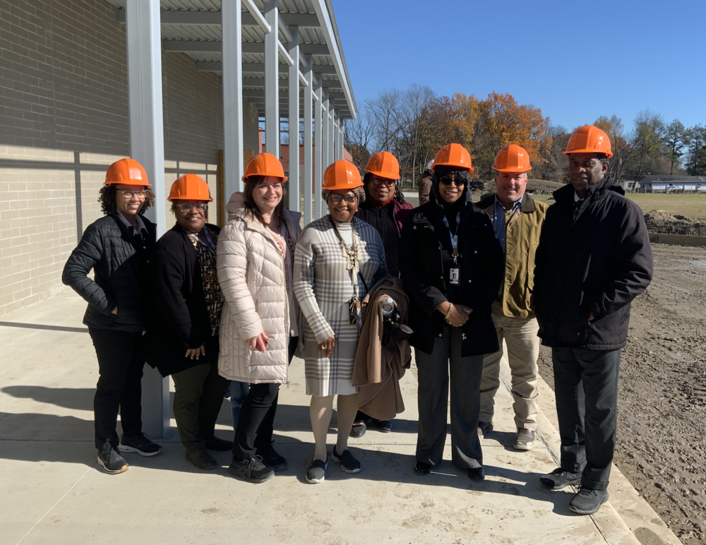 Wonder and East Junior High leaders in hard hats.