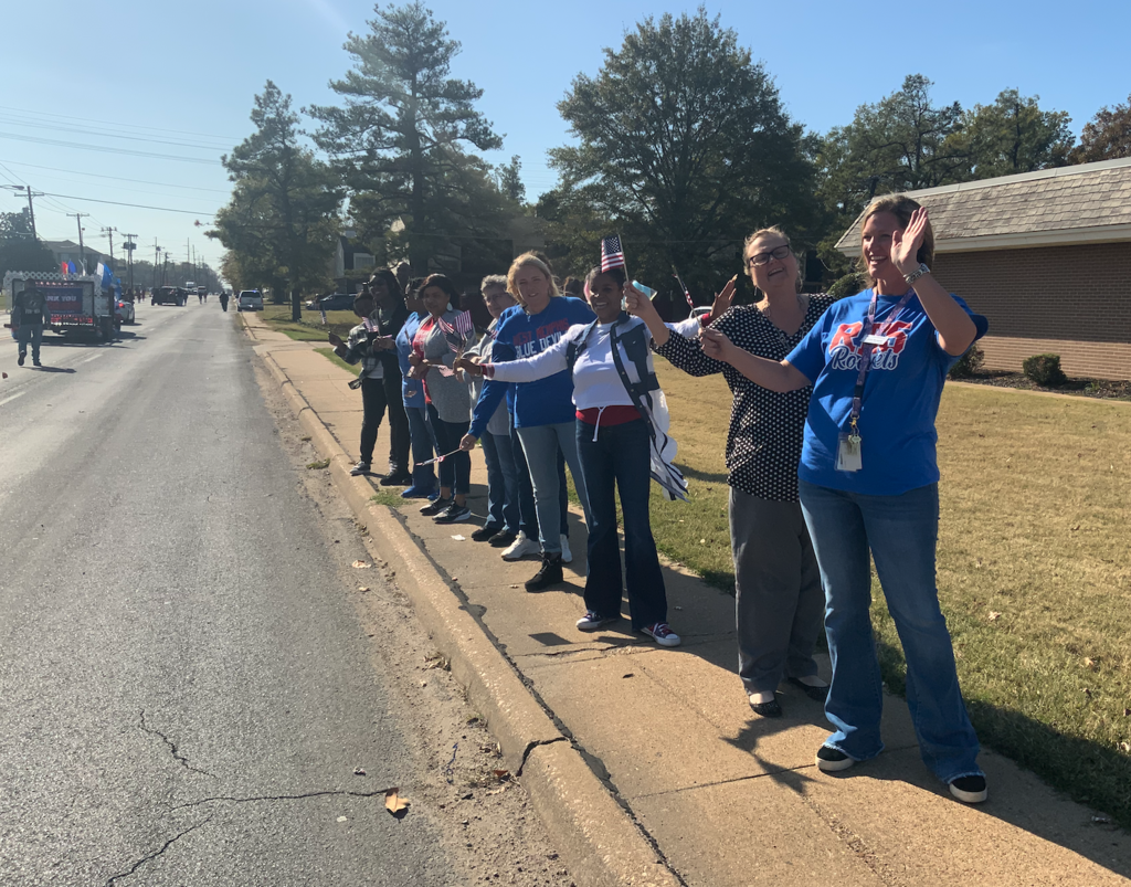Central office staff cheering on vets.
